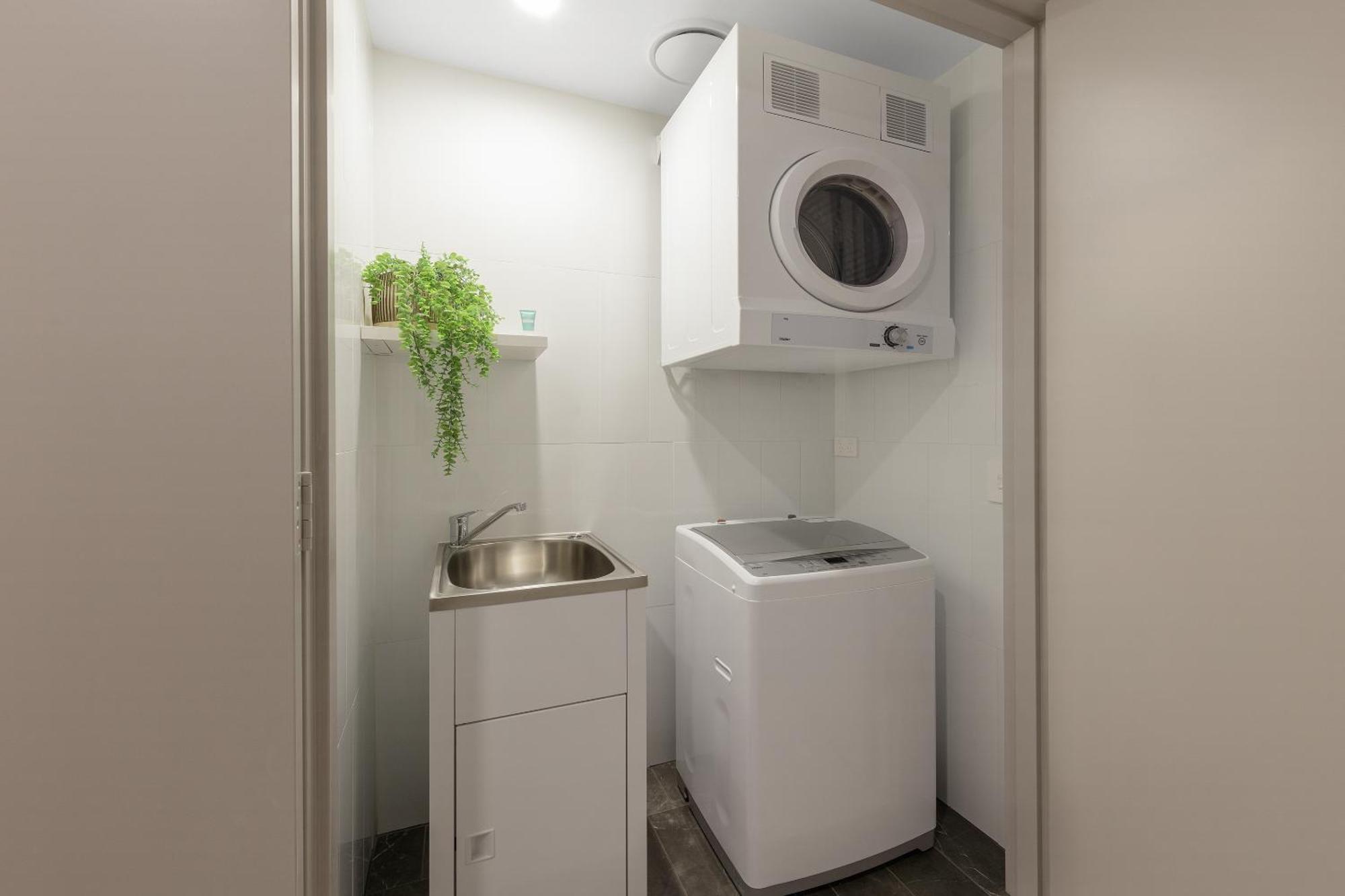 Meriton Suites North Ryde Sidney Exterior foto Laundry room